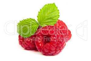 Ripe rasberry with green leaf isolated over white. Close up macr