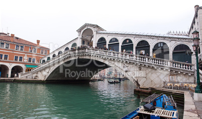 Venice Grand canal with gondolas and Rialto Bridge