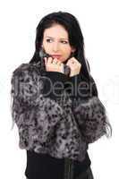 The young beautiful girl in a fur coat