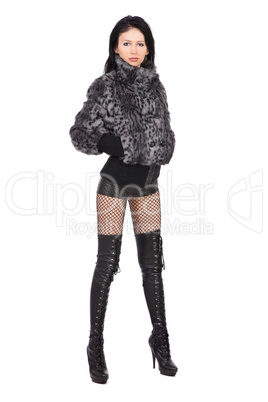 The young beautiful girl in a fur coat