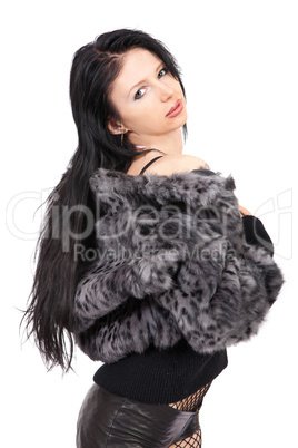 The young beautiful girl in a fur coat