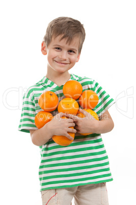 Boy holding oranges