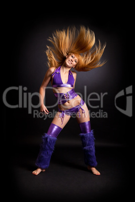 Young woman dancing with flowing hair