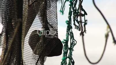 Old fishing nets blowing in the wind. Old and rusted machinery. HD 1080p. Beach in Reykjavik Iceland.