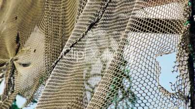 Old fishing nets blowing in the wind. Old and rusted machinery. HD 1080p. Beach in Reykjavik Iceland.