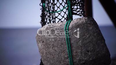 Old fishing nets blowing in the wind. Old and rusted machinery. HD 1080p. Beach in Reykjavik Iceland.