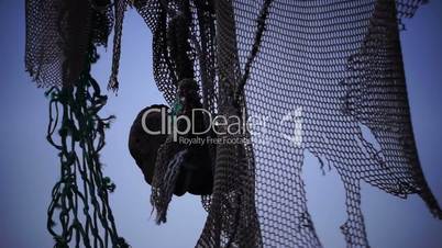 Old fishing nets blowing in the wind. Old and rusted machinery. HD 1080p. Beach in Reykjavik Iceland.