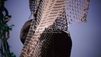 Old fishing nets blowing in the wind. Old and rusted machinery. HD 1080p. Beach in Reykjavik Iceland.