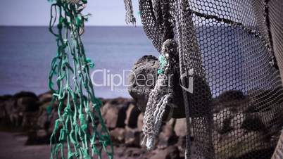 Old fishing nets blowing in the wind. Old and rusted machinery. HD 1080p. Beach in Reykjavik Iceland.