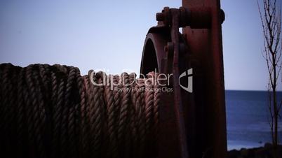 Old fishing nets blowing in the wind. Old and rusted machinery. HD 1080p. Beach in Reykjavik Iceland.