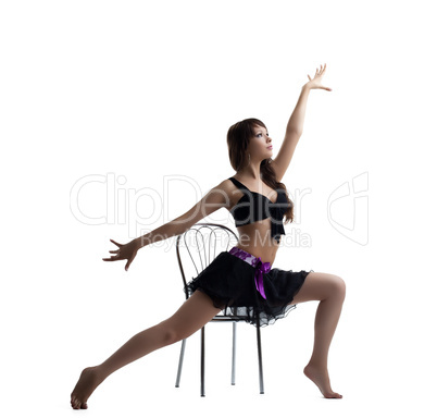 Sexy dance instructor show exercise with chair