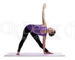 young woman posing in yoga asana on rubber mat