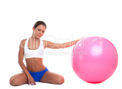 young woman relax with fitness ball isolated