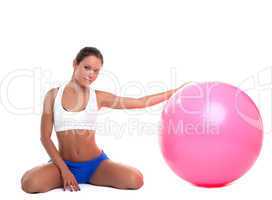 young woman relax with fitness ball isolated