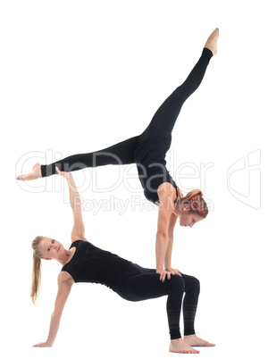 two young woman in black show acrobatic exercise