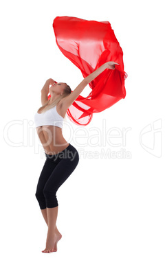 Young blond woman dance with red flying fabric