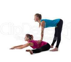 fitness instructor help woman exercise stretch