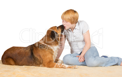 Affectionate woman kissing her dog