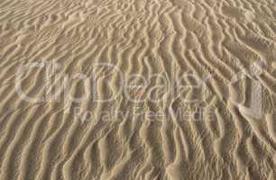 Hintergrund - Wellen im Sand