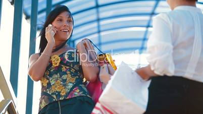 cheerful women with shopping bags