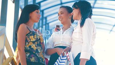 Cheerful Women with Shopping Bags Laughing