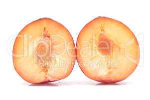 plum on a white background, close-up