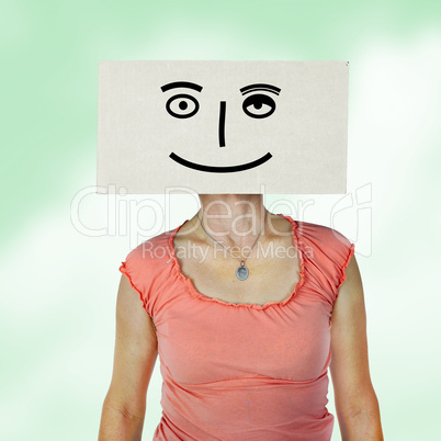 Woman has box with painted face on the head