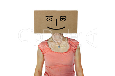 Woman has box with painted face on the head