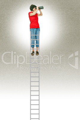 Woman standing on the ladder and looking into the distance with binoculars