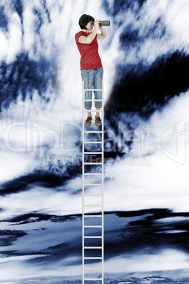 Woman standing on the ladder and looking into the distance with binoculars