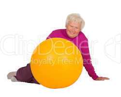 Healthy retired woman with gym ball