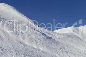 Skiers and snowboarders on ski piste