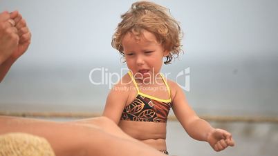 A little girl playing at the beach