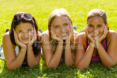 Teen women relaxing in park smiling friends