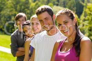 Teens smiling in the park campus students