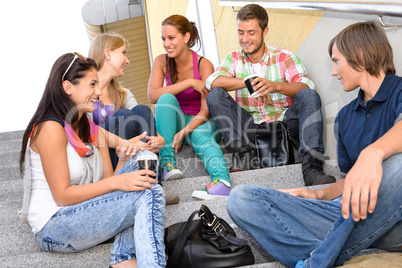 Students laughing on school stairs in break