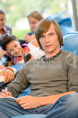 High-school students in study room reading writing