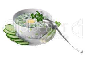 Summer cold soup with vegetables  on a white background