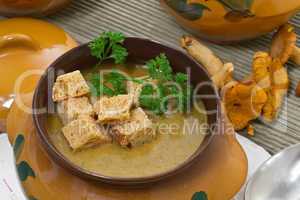 Chanterelle soup puree served with croutons
