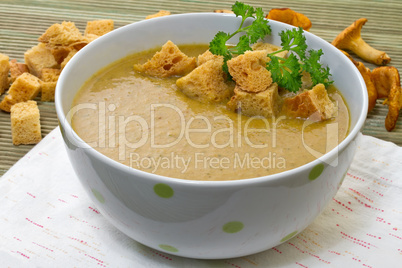 Chanterelle soup puree served with croutons