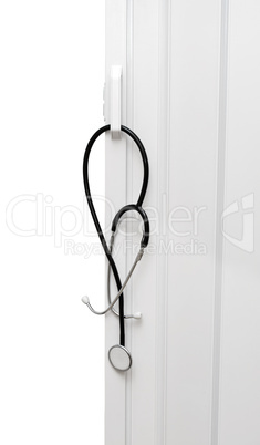 Medical stethoscope hanging on the door