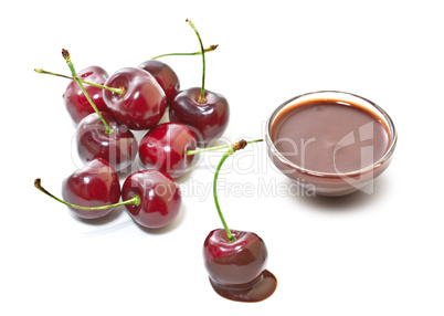 Cherries in chocolate on a white background