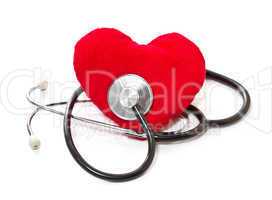 Medical stethoscope and plush heart on a white background