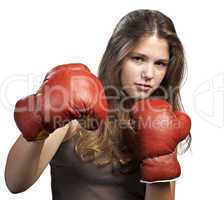 Attractive young woman wearing boxing gloves