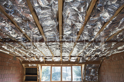 Fibreglass insulation installed in the sloping ceiling of a hous
