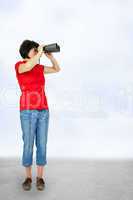 Woman looks through binoculars