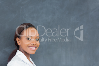 Teacher next to a blackboard