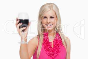Blonde holding a glass of wine