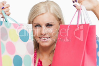 Pretty blonde holding shopping bags