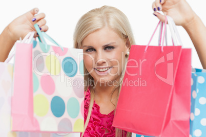 Beautiful blonde showing shopping bags